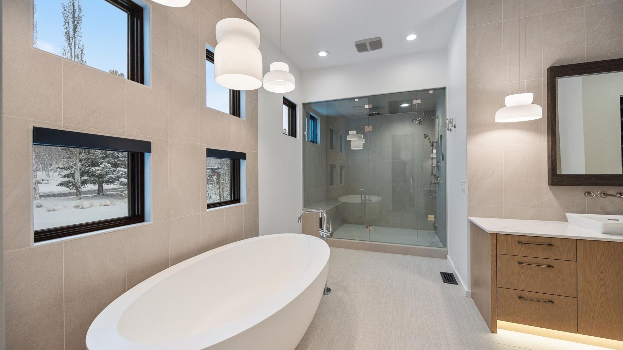 Full bath with tile walls, a soaking tub, a shower stall, and  vanity